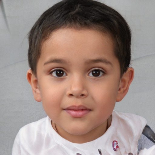 Joyful white child male with short  brown hair and brown eyes