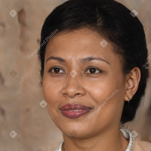 Joyful black adult female with medium  brown hair and brown eyes