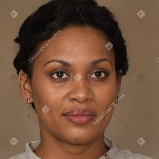 Joyful black adult female with short  brown hair and brown eyes