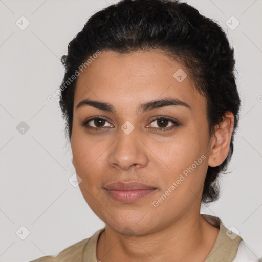 Joyful latino young-adult female with short  black hair and brown eyes