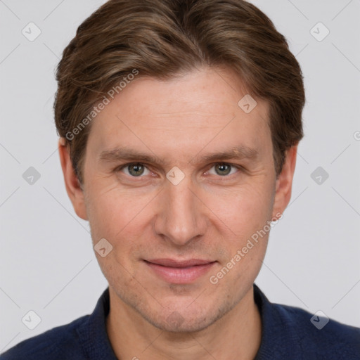 Joyful white adult male with short  brown hair and grey eyes