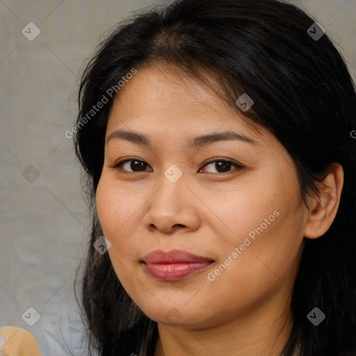 Joyful asian young-adult female with long  brown hair and brown eyes