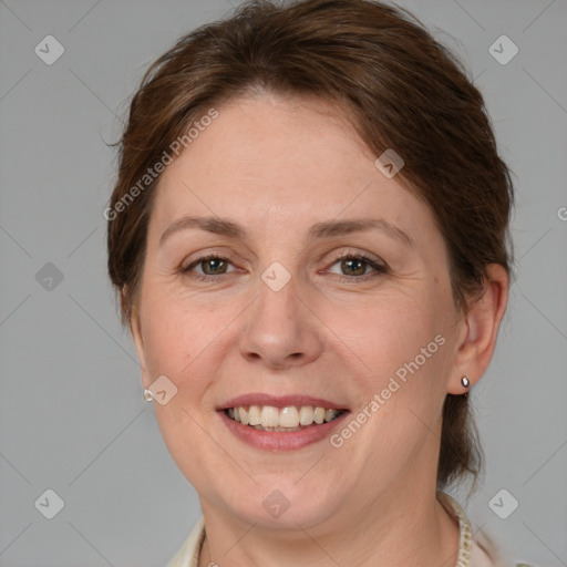 Joyful white adult female with medium  brown hair and grey eyes