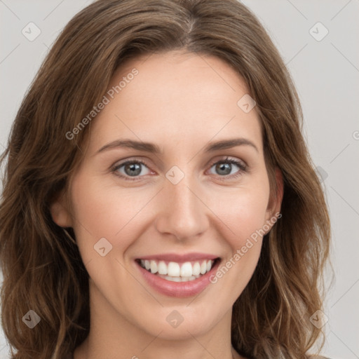 Joyful white young-adult female with long  brown hair and green eyes