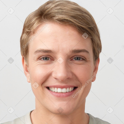 Joyful white young-adult female with short  brown hair and grey eyes