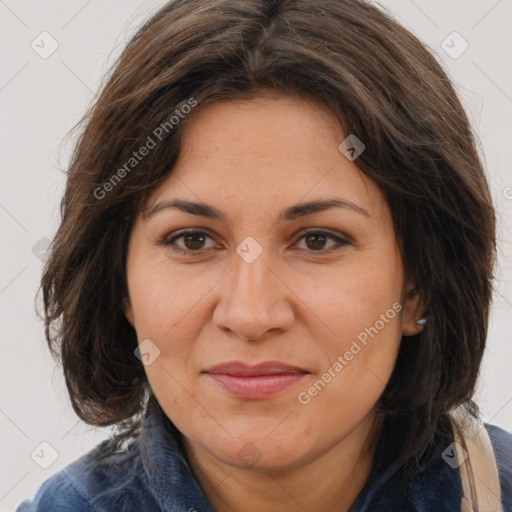 Joyful white adult female with long  brown hair and brown eyes