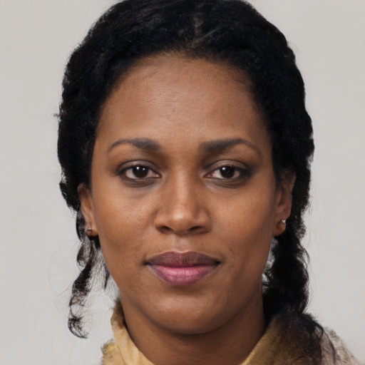 Joyful black young-adult female with medium  black hair and brown eyes