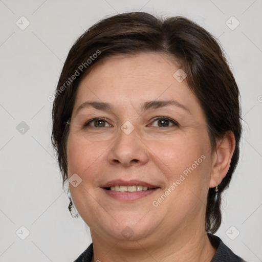 Joyful white adult female with medium  brown hair and brown eyes