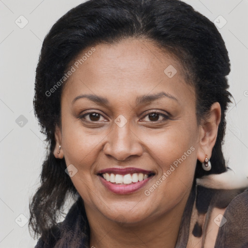 Joyful black adult female with medium  brown hair and brown eyes