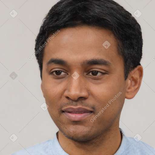 Joyful latino young-adult male with short  black hair and brown eyes