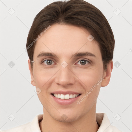 Joyful white young-adult female with short  brown hair and grey eyes