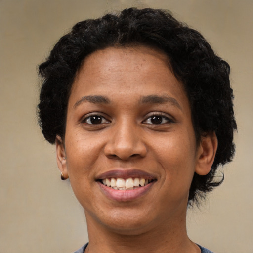 Joyful latino young-adult female with short  black hair and brown eyes