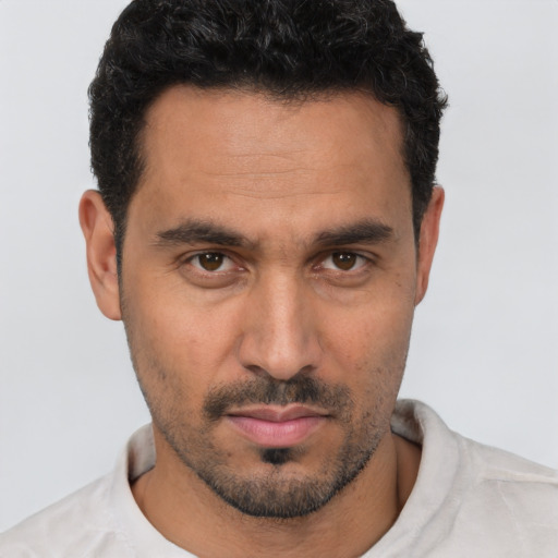 Neutral white young-adult male with short  black hair and brown eyes
