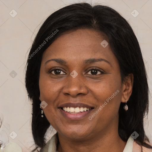 Joyful black adult female with medium  brown hair and brown eyes