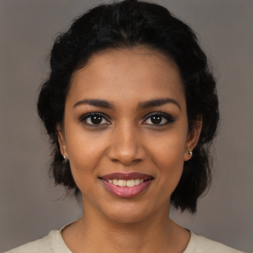 Joyful latino young-adult female with medium  black hair and brown eyes