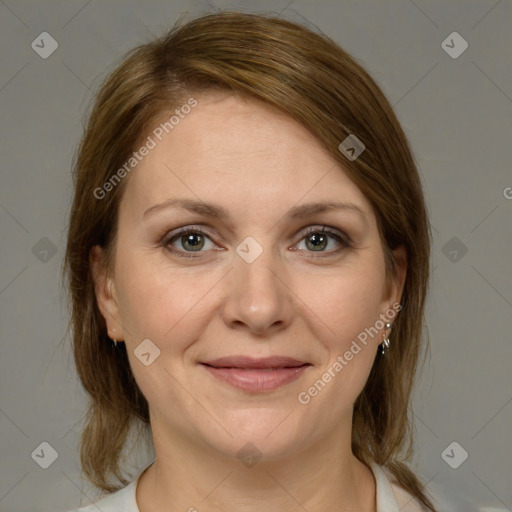 Joyful white adult female with medium  brown hair and grey eyes