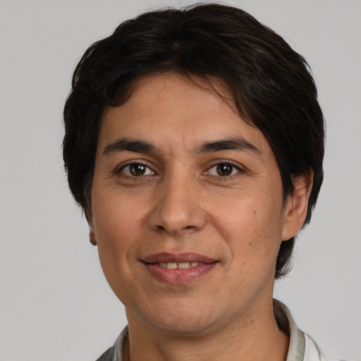 Joyful white adult male with medium  brown hair and brown eyes