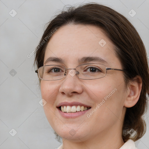 Joyful white adult female with medium  brown hair and brown eyes