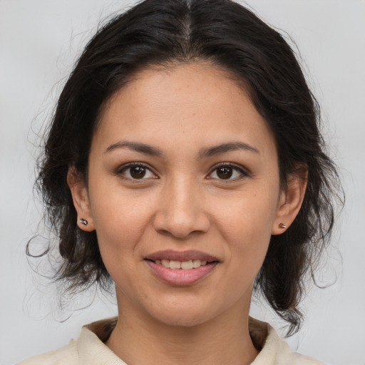 Joyful white young-adult female with medium  brown hair and brown eyes