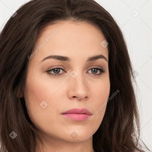 Neutral white young-adult female with long  brown hair and brown eyes