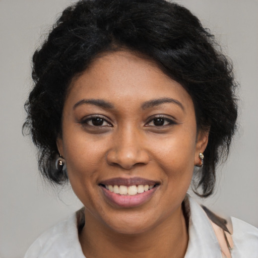 Joyful latino young-adult female with medium  black hair and brown eyes