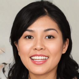 Joyful asian young-adult female with medium  black hair and brown eyes