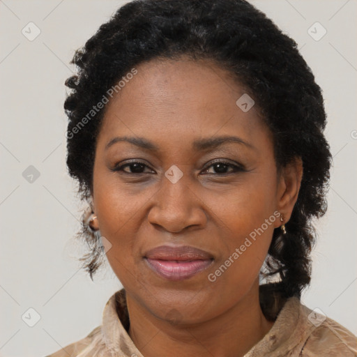 Joyful black adult female with medium  black hair and brown eyes