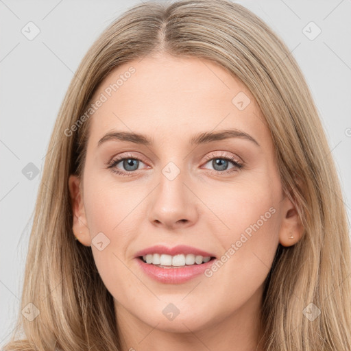 Joyful white young-adult female with long  brown hair and blue eyes