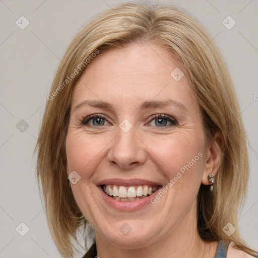 Joyful white adult female with medium  brown hair and grey eyes