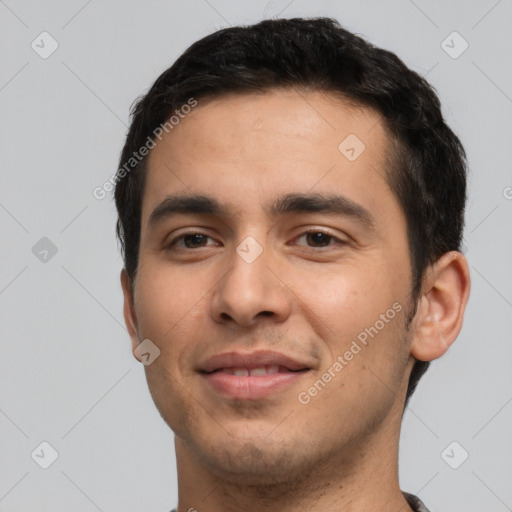 Joyful white young-adult male with short  black hair and brown eyes