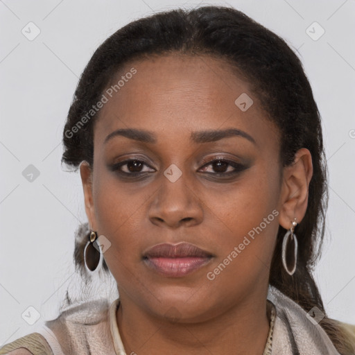 Joyful black young-adult female with long  brown hair and brown eyes