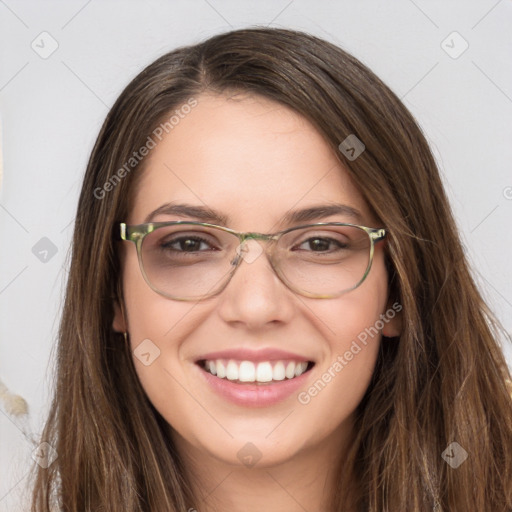 Joyful white young-adult female with long  brown hair and green eyes