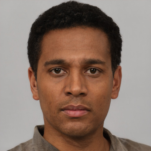 Neutral latino young-adult male with short  brown hair and brown eyes