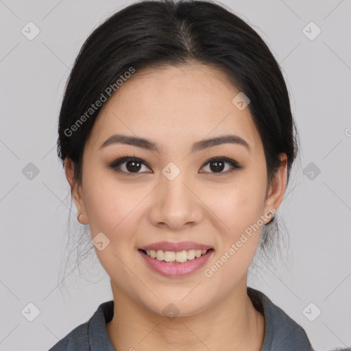 Joyful asian young-adult female with medium  black hair and brown eyes