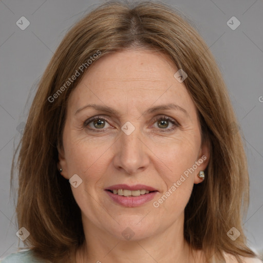 Joyful white adult female with medium  brown hair and brown eyes