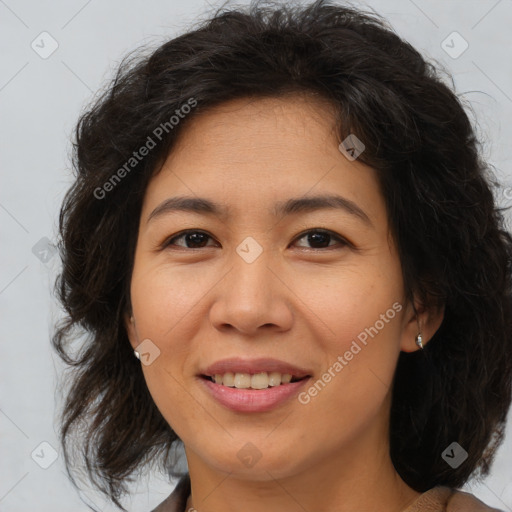 Joyful asian adult female with medium  brown hair and brown eyes