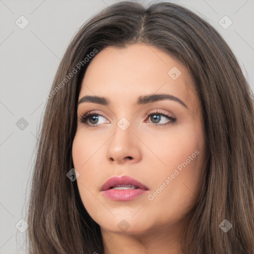 Neutral white young-adult female with long  brown hair and brown eyes