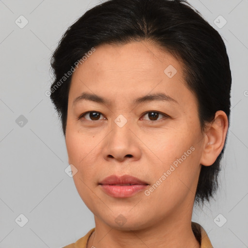 Joyful asian young-adult female with short  brown hair and brown eyes