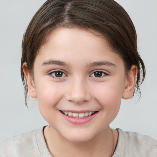 Joyful white child female with medium  brown hair and brown eyes