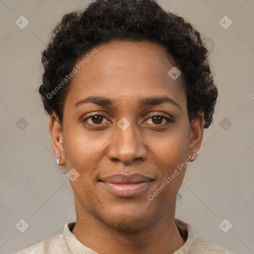 Joyful black young-adult female with short  black hair and brown eyes