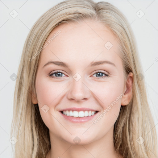 Joyful white young-adult female with long  brown hair and blue eyes