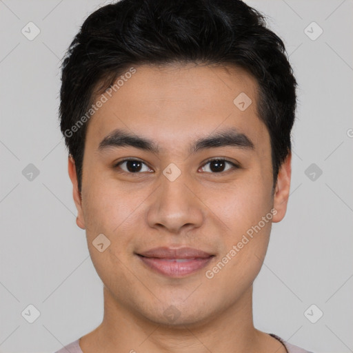 Joyful asian young-adult male with short  black hair and brown eyes