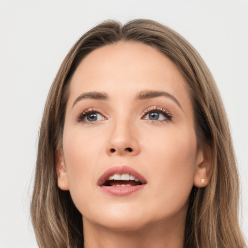 Neutral white young-adult female with long  brown hair and grey eyes