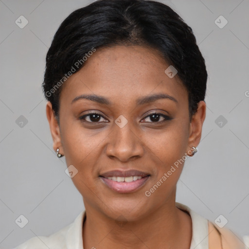 Joyful black young-adult female with short  black hair and brown eyes