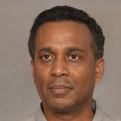 Neutral black adult male with short  black hair and brown eyes