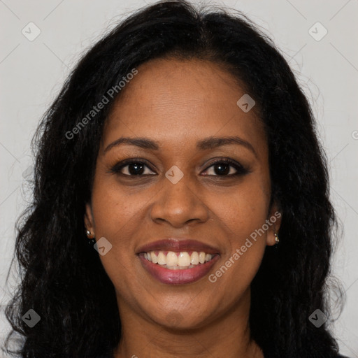 Joyful black young-adult female with long  brown hair and brown eyes