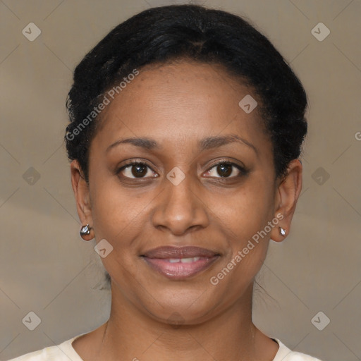Joyful black young-adult female with short  brown hair and brown eyes
