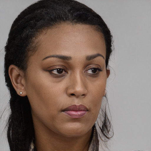 Neutral black young-adult female with long  brown hair and brown eyes