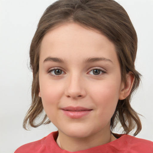 Joyful white child female with medium  brown hair and grey eyes