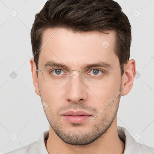 Neutral white young-adult male with short  brown hair and brown eyes